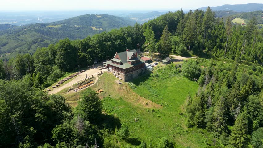 Aerial flight over green forested mountain ridge in the Beskids on a summer day Poland ,wisła 
