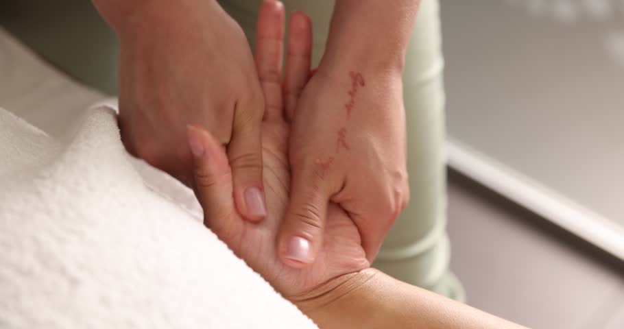 Woman receiving professional massage in salon, closeup