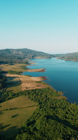 Aerial of lake surrounded by hills