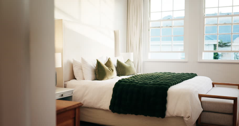 Luxury, room and bed in hotel, interior design and furniture with decor, real estate and hospitality. Empty, accommodation and cozy blanket in bedroom, comfort and tidy motel or travel destination