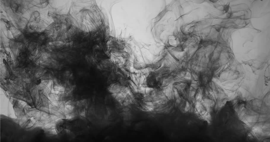 Colored ink clouds floating slowly in the water 
