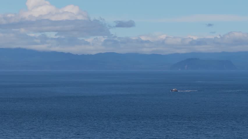Boat Navigating the Vast Ocean Waters Off Vancouver Island, British Columbia, Canada