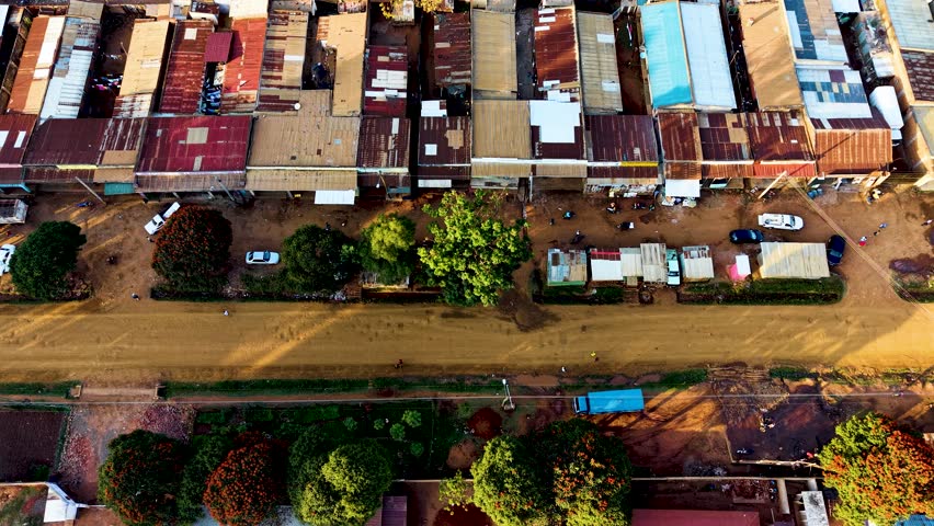 Houses of Kibera slums, roads in Soweto informal settlement nairobi kenya. Drone flying in the rural settlement of kenya slums