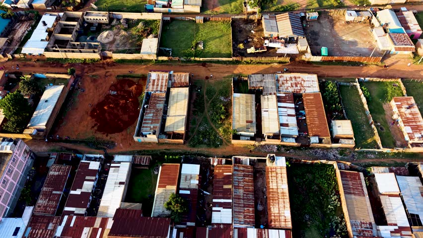Houses of Kibera slums, roads in Soweto informal settlement nairobi kenya. Drone flying in the rural settlement of kenya slums