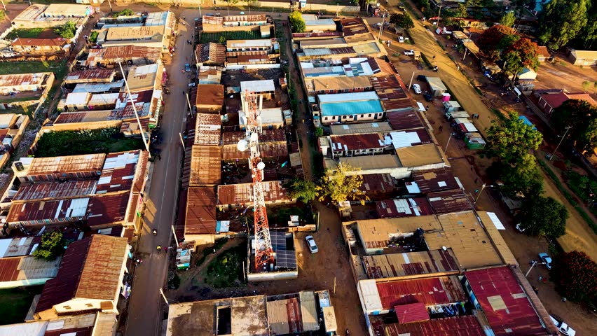 Houses of Kibera slums, roads in Soweto informal settlement nairobi kenya. Drone flying in the rural settlement of kenya slums