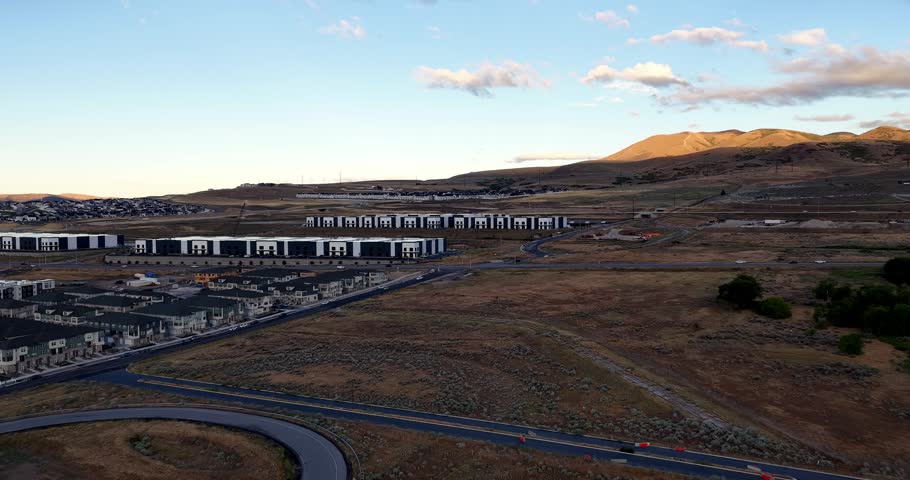 Aerial view of new business park and urban sprawl with modern buildings and roads in Bluffdale, Utah, United States.