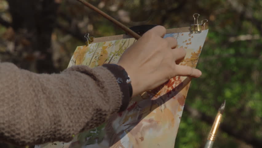 Artist Painting Autumn Watercolor Landscape In Forest On Sunny Day