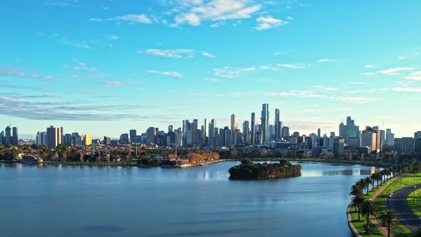 Sunrise view of Yarra river and Melbourne skyscrapers business office building with evening skyline in Victoria, Albert Park, Australia