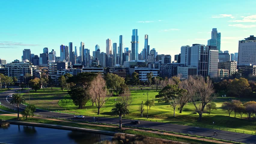 Sunrise view of Yarra river and Melbourne skyscrapers business office building with evening skyline in Victoria, Albert Park, Australia