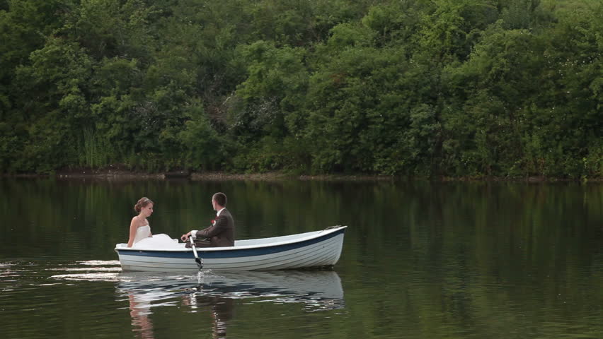 Wedding couple rowing boat on stock footage video 100 royaltyfree