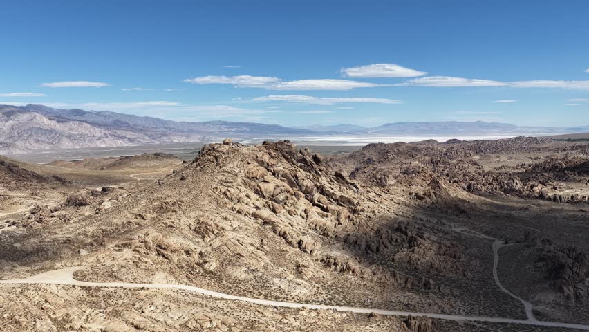 Aerial Drone View of Alabama Hills Rock Formations with Owens Valley and Sierra Nevada Mountains in Background, Lone Pine California