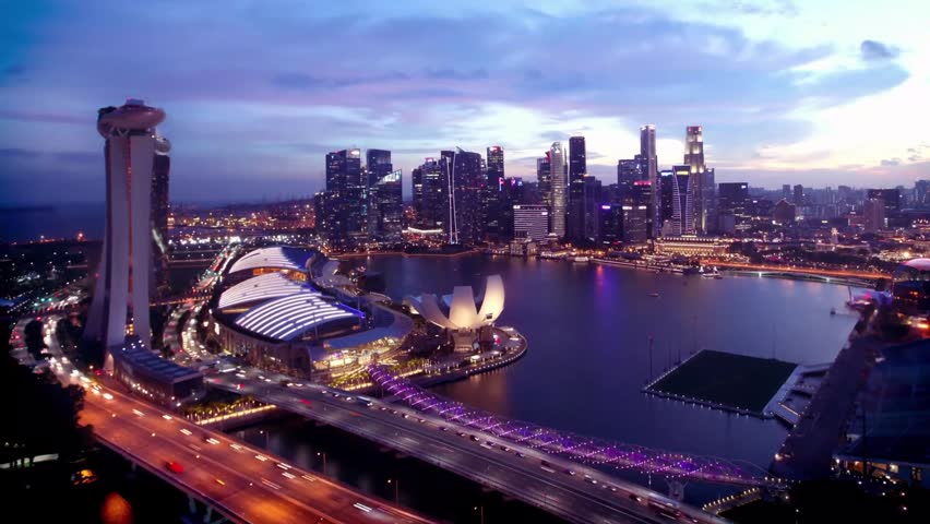 Horizontal Aerial Timelapse of Singapore Marina Bay Skyline at Dusk