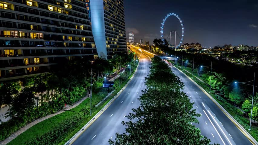 Horizontal Night Timelapse of Singapore Traffic Light Trails and Flyer