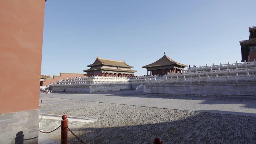 view through huge red gate with view of grand main building of forbidden city beijing grand palace in city center of beijing in winter sunny day,landmark china architecture building