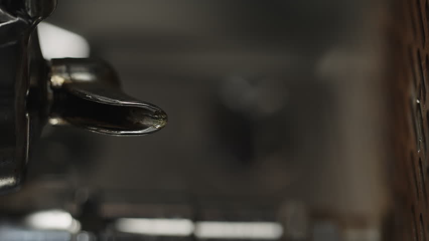 Slow motion rinse espresso machine closeup