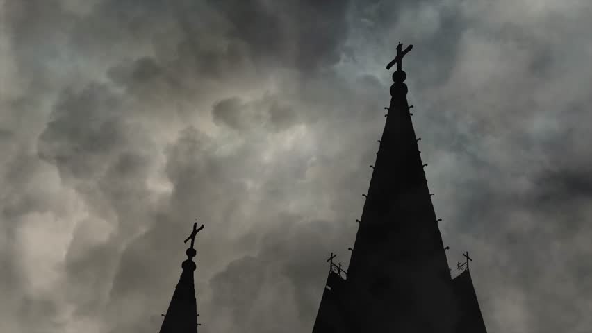 Silhouette of Gothic Church Spires Against Dramatic Storm Clouds