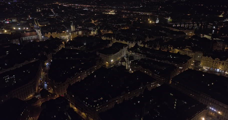 Prague Czechia Aerial v95 birds eye view drone flyover old town district capturing night cityscape and light up narrow streets, tilt up reveals hilltop castle - Shot with 5k Camera - November 2022