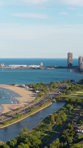 Elevated cityscape of Chicago showing Lincoln Park, Lake Shore Drive, North Avenue Beach, Navy Pier with Centennial Wheel, Lake Michigan in vertical
