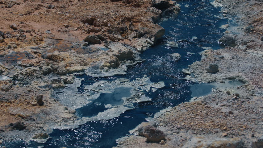 Lake with geothermal activity near the volcano of Golovnin on Kunashir island in Russia