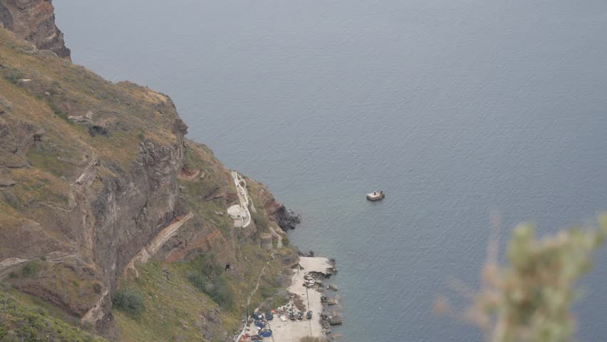 Old Port of Fira in Santorini, Greece, set beneath the dramatic caldera cliffs of the island’s capital.
