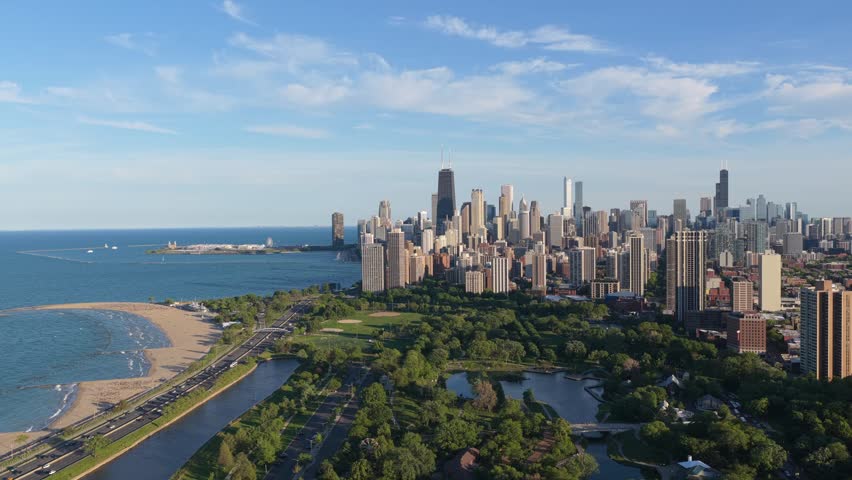 Iconic Chicago skyline featuring Lincoln Park, North Avenue Beach, Lake Michigan shoreline with downtown skyscrapers like John Hancock Center and Willis Tower