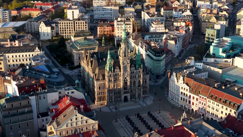 A professional drone shot of Dr. Edvard Benes Square in Liberec, Czech Republic. The video features the iconic neo-Renaissance Town Hall, showcasing the city historic architecture and urban planning from a high-altitude perspective