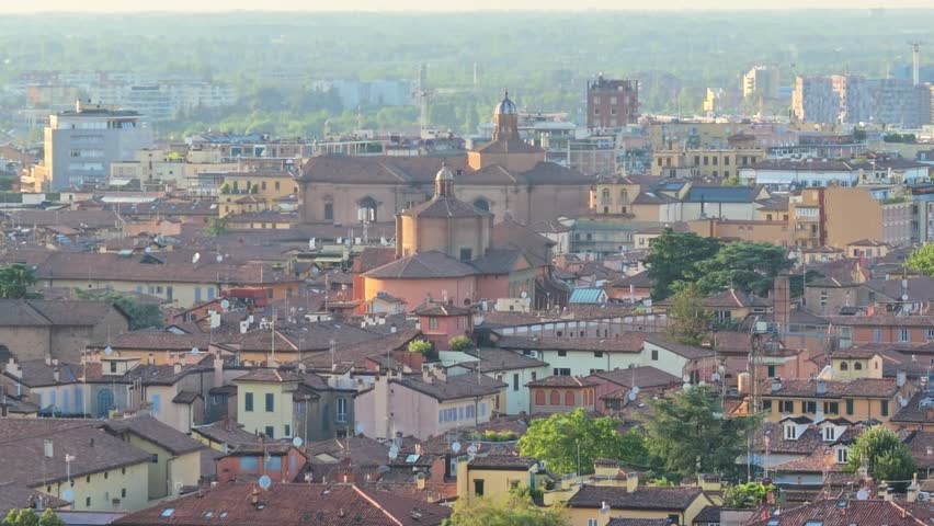 Close up of the tower on the cityscape of Bologna in Italy. The medieval Two Towers are the symbol of city in the blue sky. Asinelli and Garisenda tower in historic downtown with the town buildings