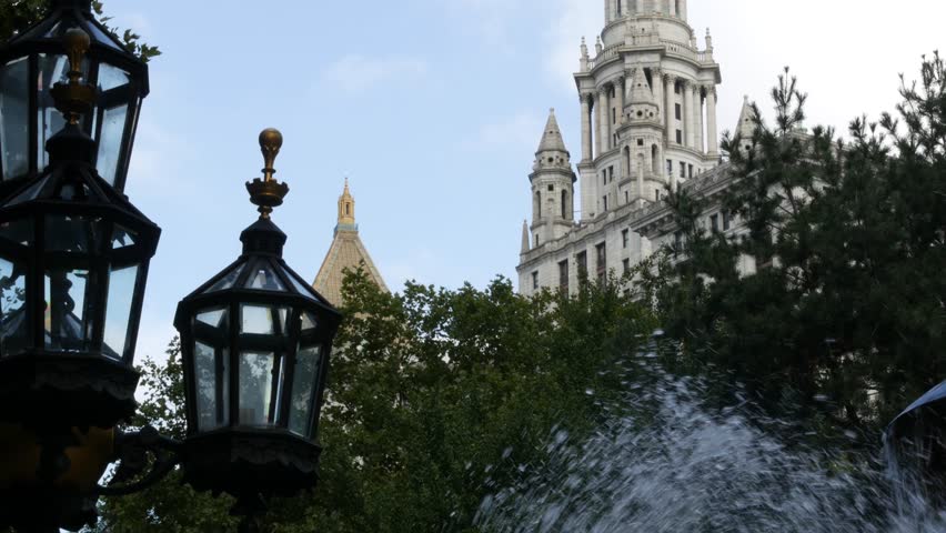 New York City Downtown Civic Center, United States of America. Manhattan municipal building 1914, old historic architecture. Government administration authority from City Hall park. Fountain, lantern.