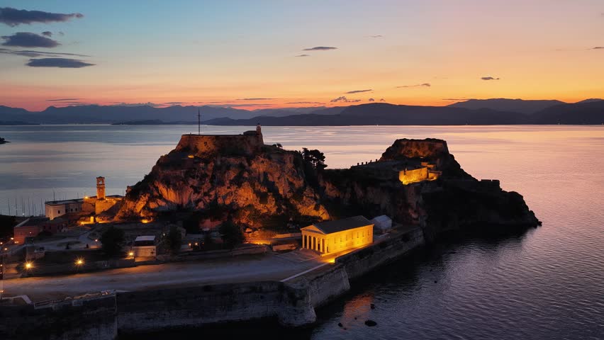 Corfu Old Fortress illuminated at twilight by the Ionian Sea