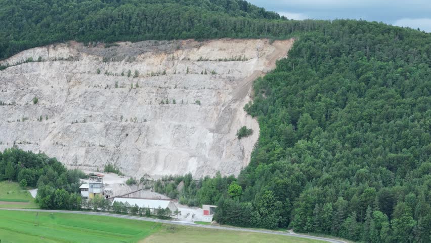 Open pit quarry in Italian mountain forest