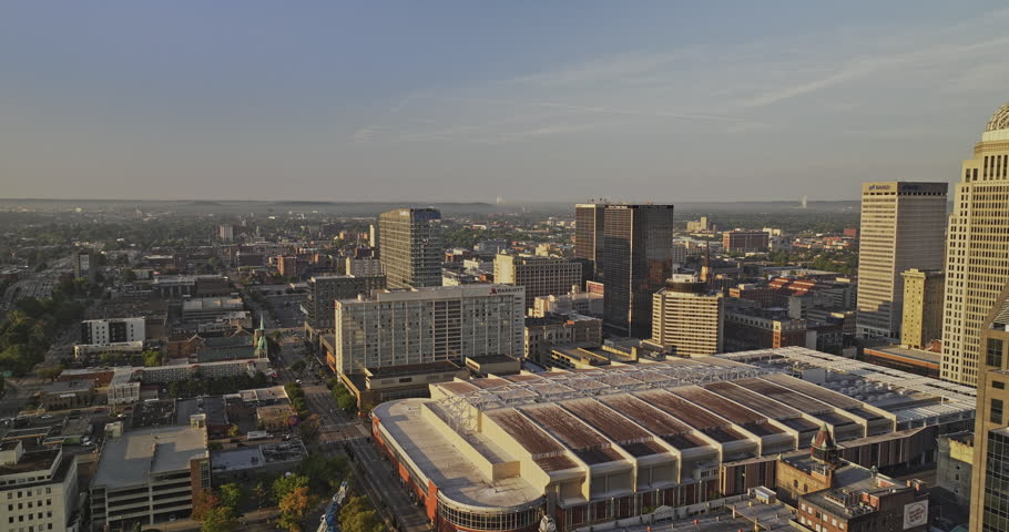 Louisville Kentucky Aerial v68 drone flyover downtown capturing vibrant urban cityscape with morning sunlight casting on the exterior of the buildings - Shot with 8k camera