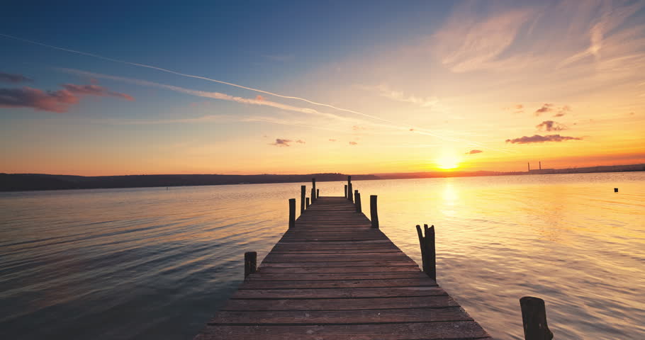 Wooden Dock on the lake during scenic sunset