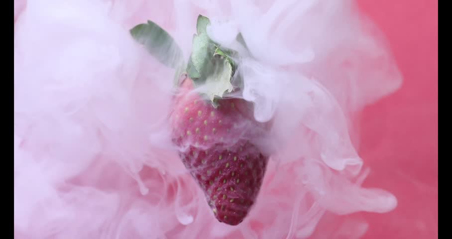 Red ripe strawberry floating on red background smoke vape mist flowing motion 