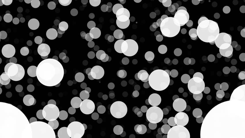 Black and white bokeh pattern featuring scattered circular dots of varying sizes, resembling falling snow or floating bubbles with a smooth glowing