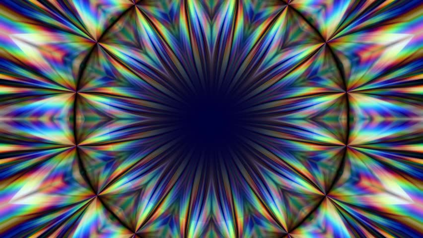 Rainbow colored kaleidoscope pattern with radiating spikes arranged in a circular symmetrical burst around a dark center with a smooth glowing today