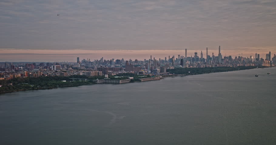 NYC New York Aerial v249 panoramic panning view drone flyover Hudson River capturing cityscape of Upper Manhattan and Edgewater in New Jersey at sunset - Shot with 8k camera