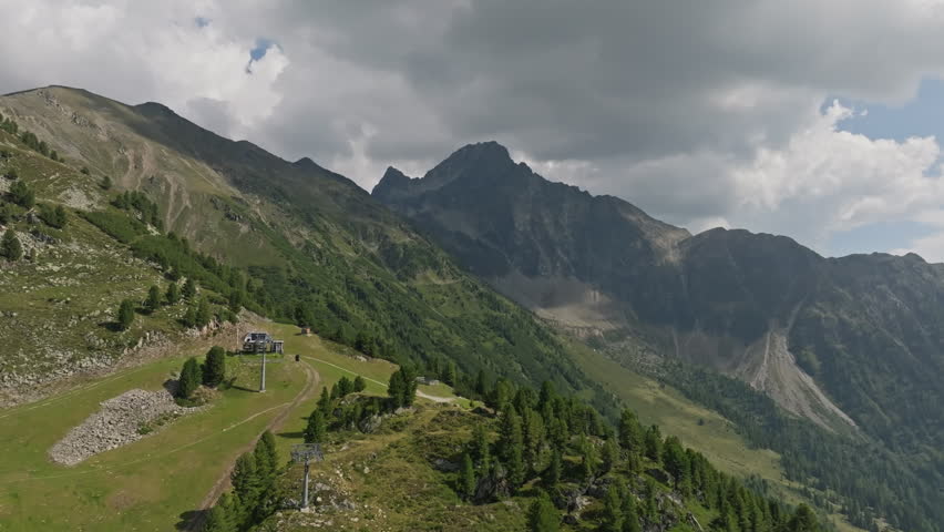 Scenic aerial view of the Austrian Alps in Tyrol with towering mountain summits rugged cliffs and pristine natural landscapes for tourism and adventure