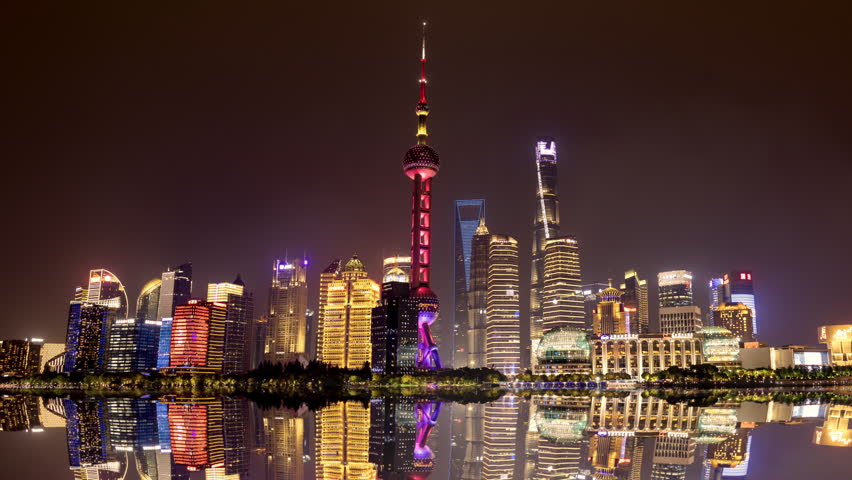SHANGHAI, CHINA - 11 JUNE 2026 : Timelapse of fantasy shanghai china with skyline reflected in water illuminated at night