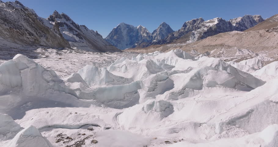 Everest region Nepal, aerial drone shot of sharp melting ice towers on Khumbu Glacier under global warming impact near Everest Base Camp.