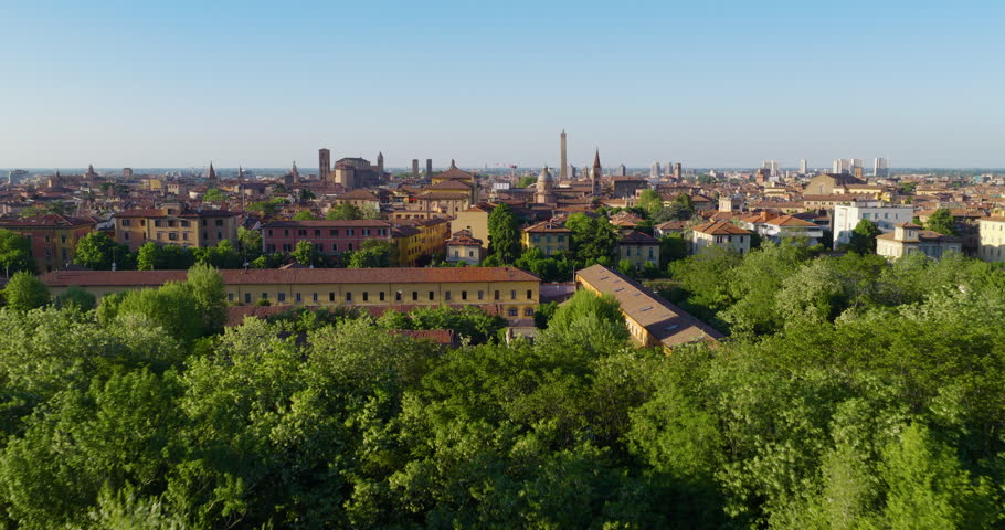 Panoramic View Of Historic City Skyline Of Bologna, Italy, With Terracotta-colored Roofs And Medieval Towers. - aerial shot