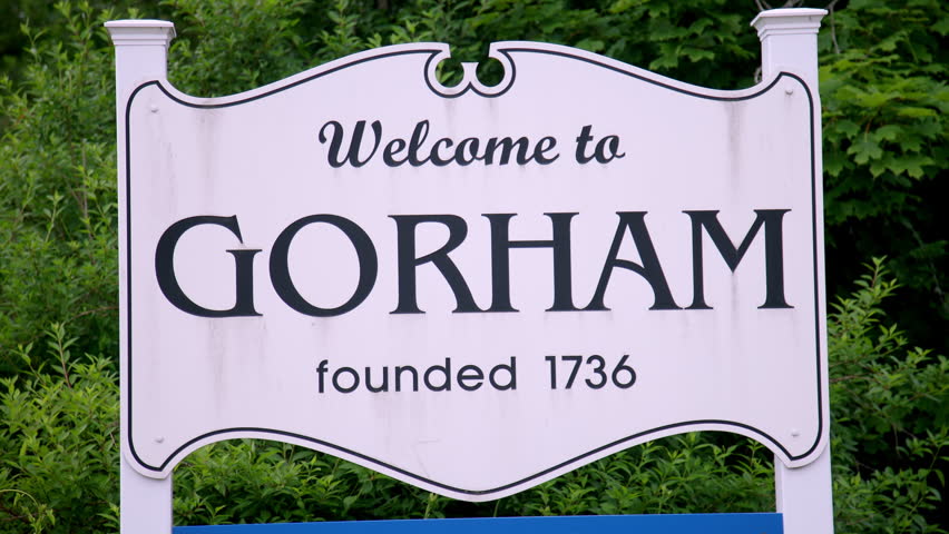 Gorham Maine welcome sign founded 1736 amid summer greenery wide static shot