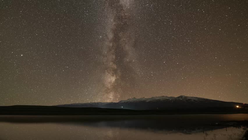 Beautiful night landscape , Milky Way  galaxy on the sky over the lake and mountains Space, night scene time lapse.