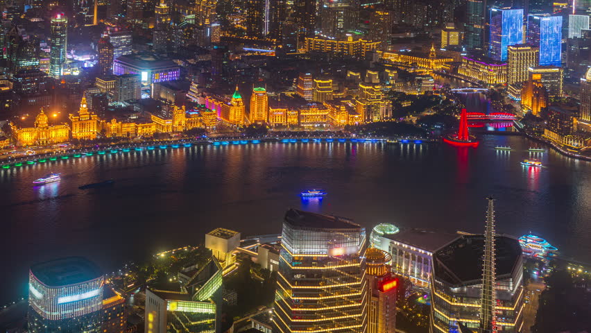 Aerial view of Shanghai city and Huangpu river at night, China.
