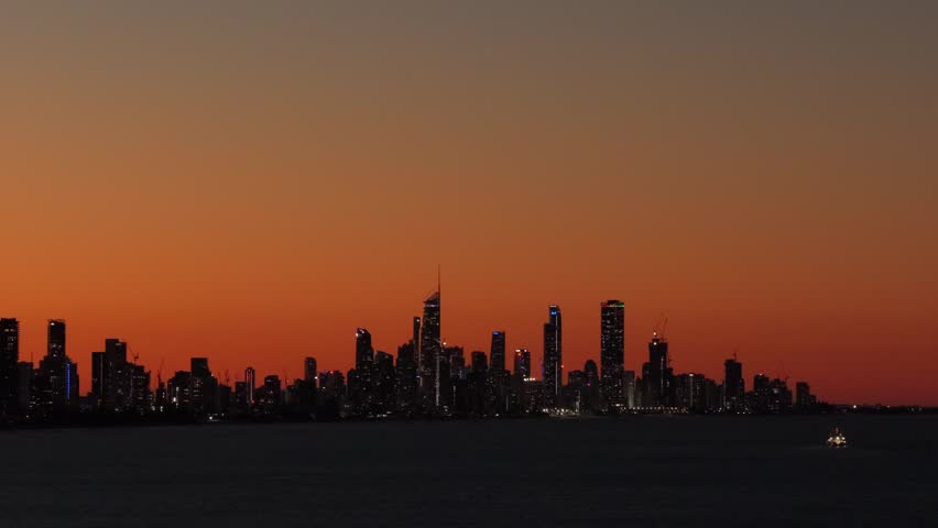 Static aerial view of the Surfers Paradise and Broadbeach skyline at twilight from Burleigh Headland on the Gold Coast, Queensland, Australia