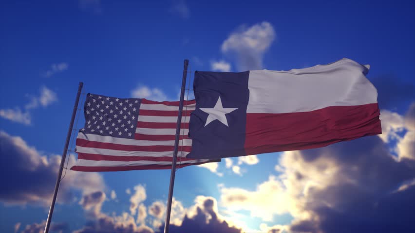 American and Texas Flags Waving Against Dramatic Blue Sky