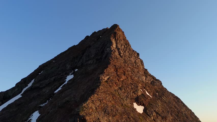 Majestic Mountain Peak with Moon in Clear Blue Sky in British Columbia, Canada