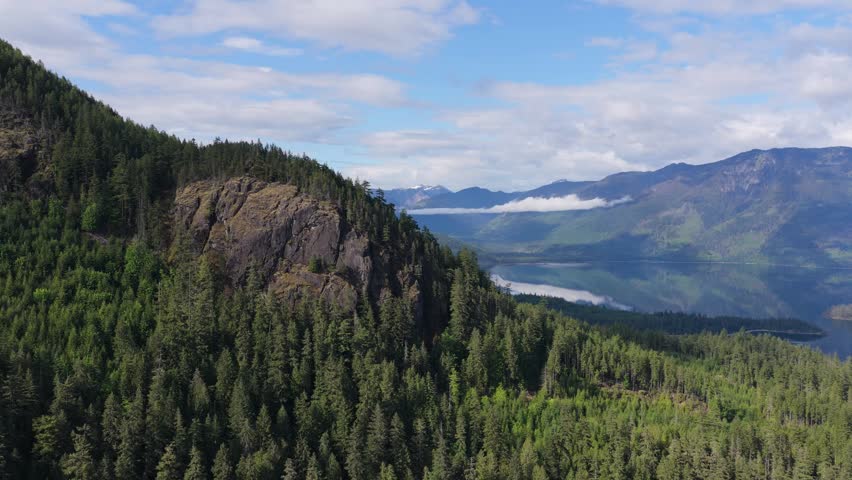 Stunning Aerial View of Serene Mountain Lake and Vast Green Forests in British Columbia, Canada