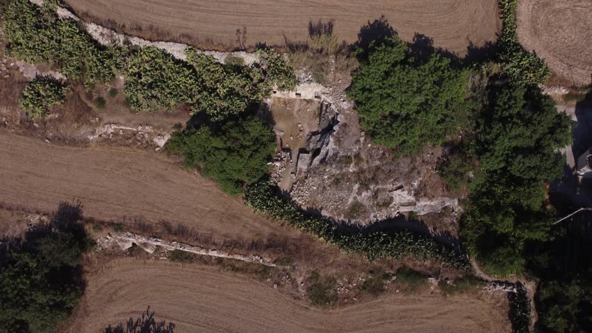 Naxar, Malta 01.07.2026 - Salini Catacombs aerial view of the field. This group of burials is situated in an area known as Ta Latnija. High quality 4k footage