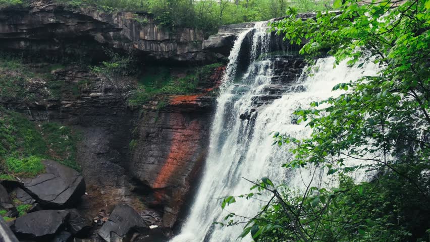 Brandwine Falls at Cuyahoga Valley National Park cascading over a large rock cliff.