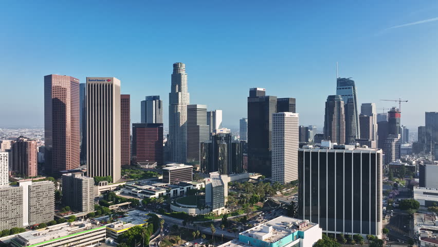 Los Angeles skyscrapers from sky. Aerial shot of Los Angeles towers. Los Angeles skyline drone footage. Downtown Los Angeles aerial scene. LA city skyline from air.